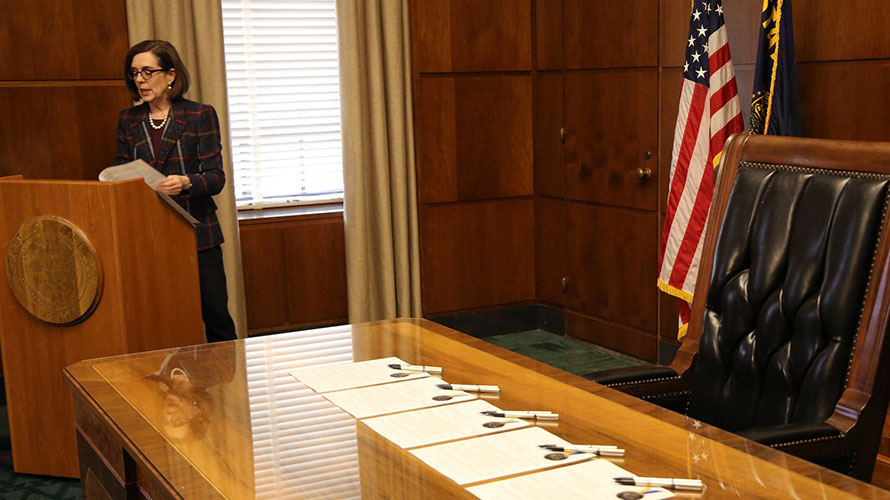 Governor standing at podium